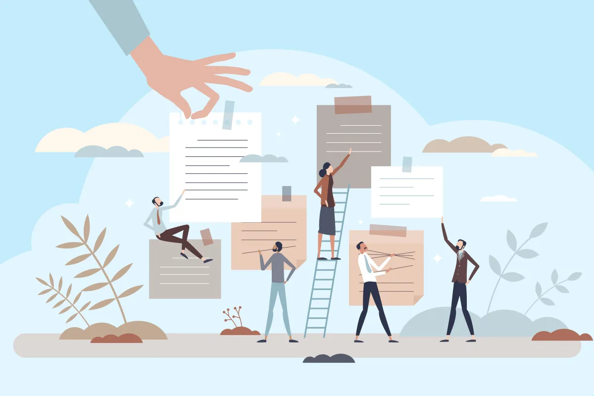 Many documents are visible and a hand puts a new one on the screen.